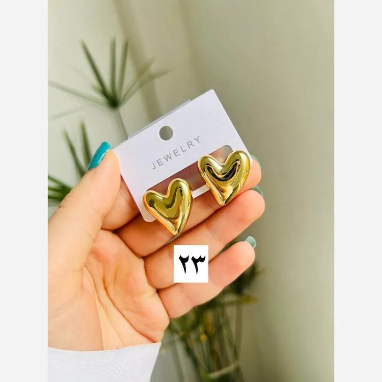 گوشواره دخترانه طرح قلب دفرمه رنگ طلایی