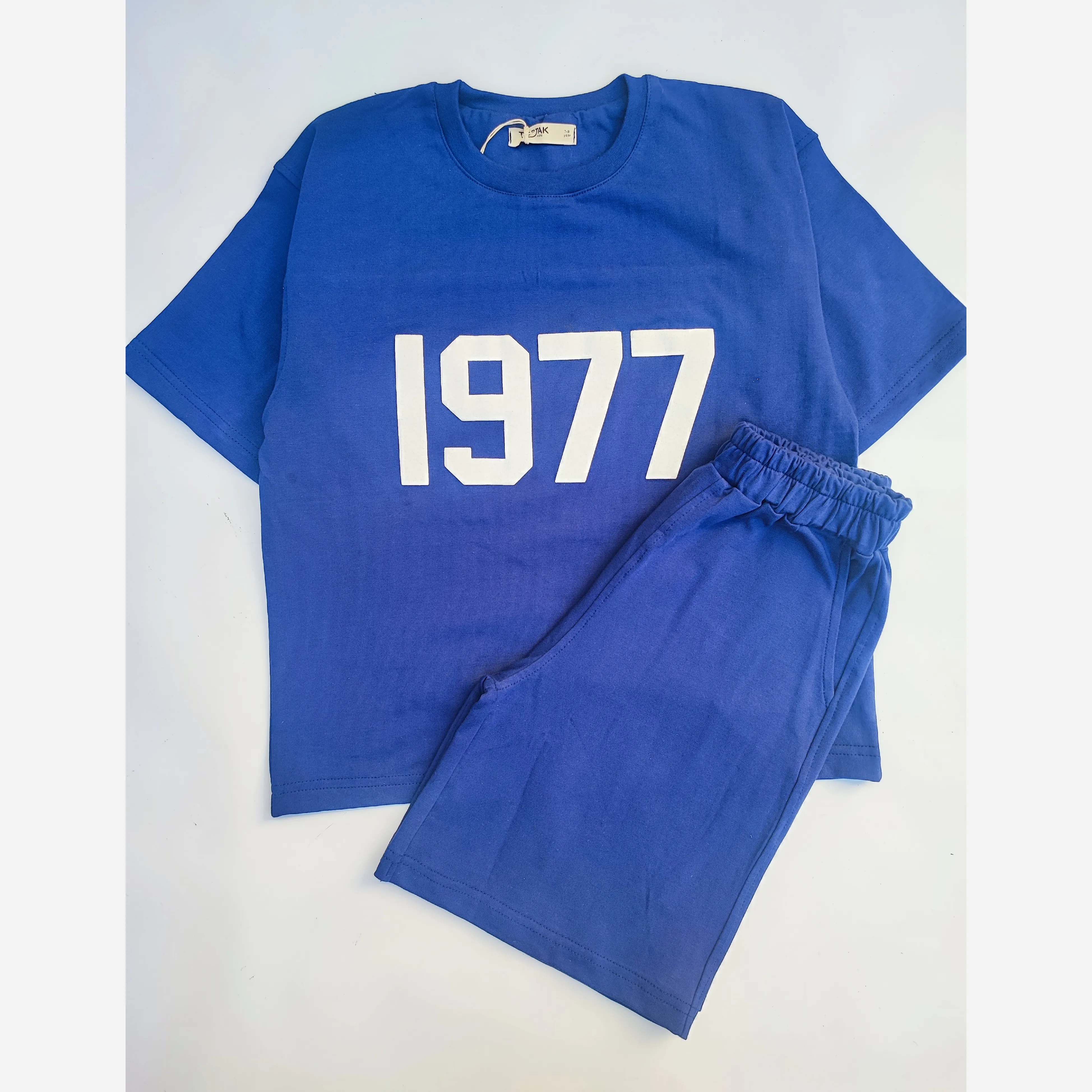 ست تیشرت و شلوارک اسپرت پسرانه و دخترانه طرح 1977 رنگ سرمه ای سایز 55 تا 75