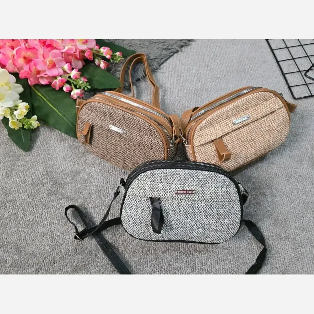کیف زنانه آیدا جنس چرم طرح کنفی سه خونه
