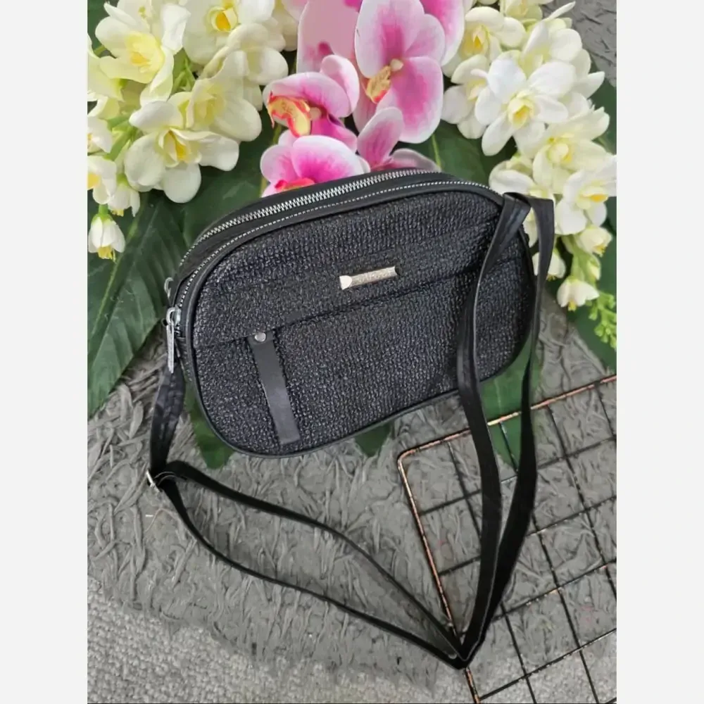 کیف زنانه آیدا جنس چرم طرح کنفی سه خونه